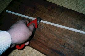 cutting slightly around wood bar